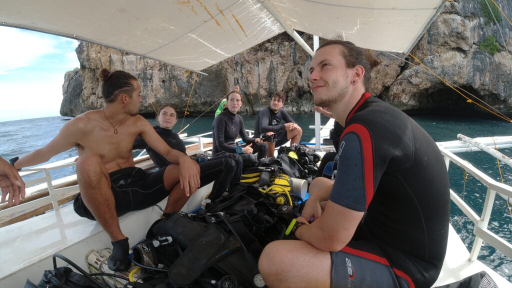 people listening to the dive brief and on a boat.