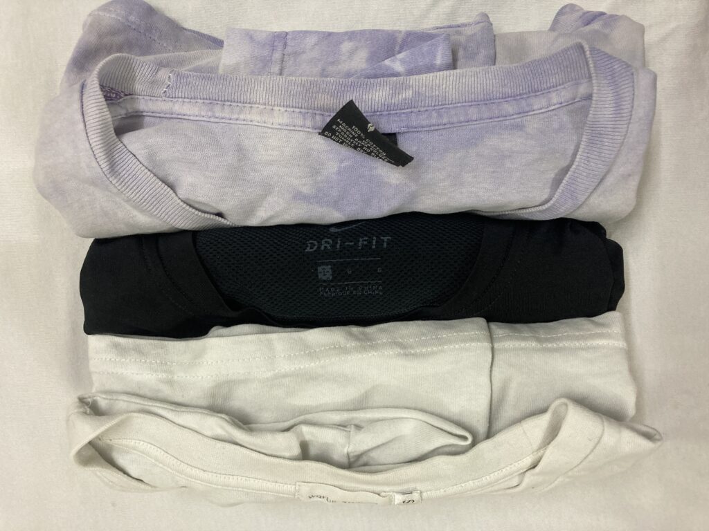 three t-shirts rolled.