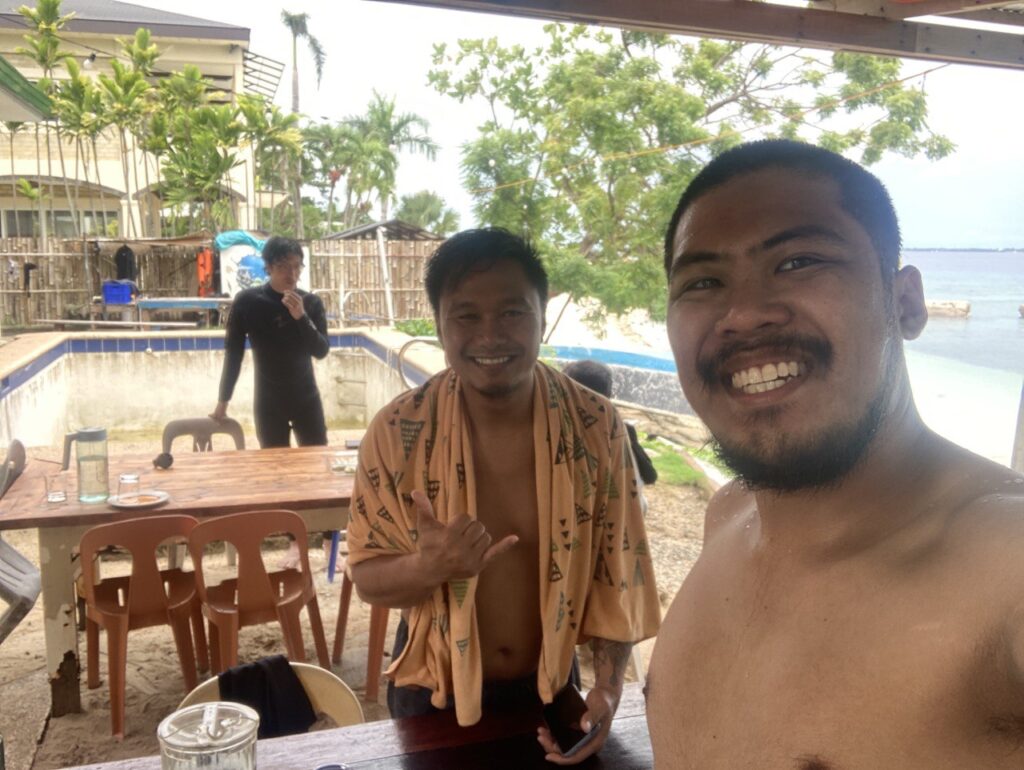 two men standing in front of a camera