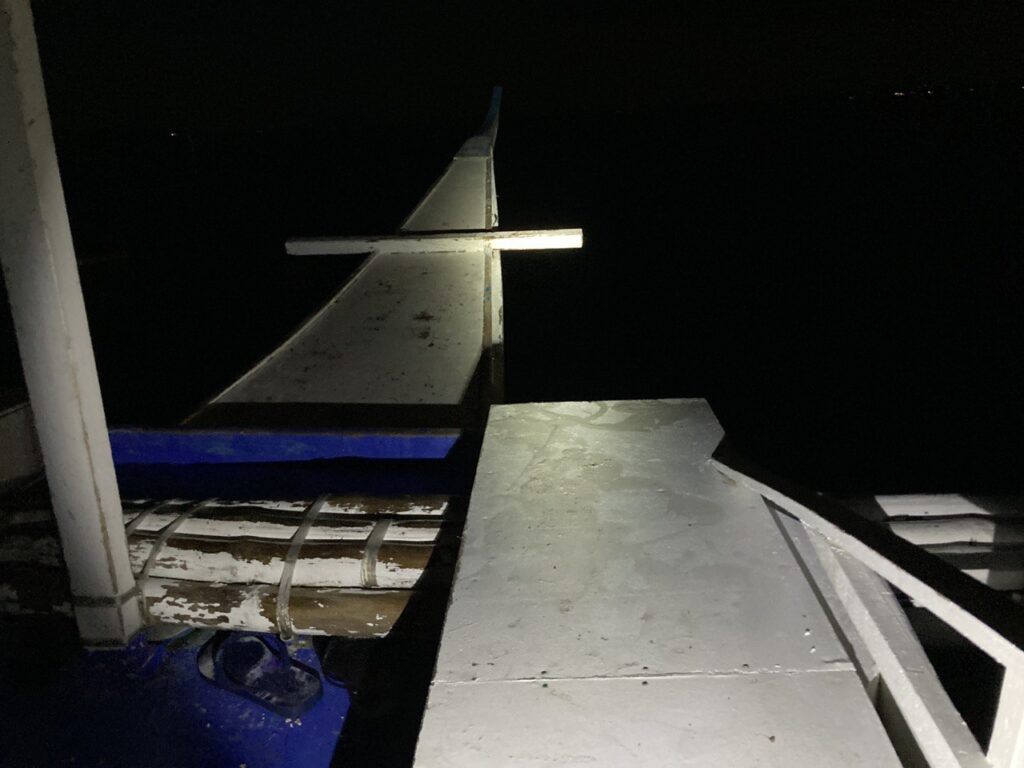 boat with a flashlight on and with dark environment.