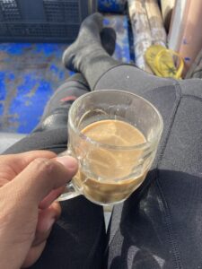 a glass of coffee on hand.