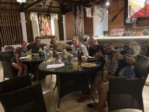 six people taking picture on a restaurant