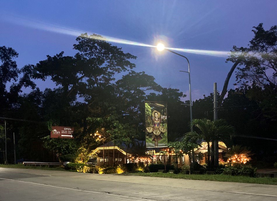 the entrance of viet ville along the road.
