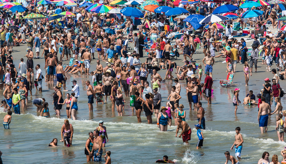 A seashore with a crowded people