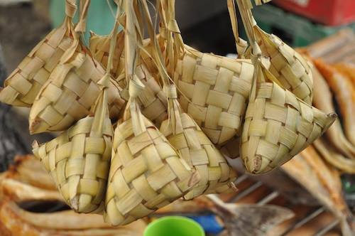 Puso or hanging rice. Rice that was cooked inside a diamond-shaped palm leaves.