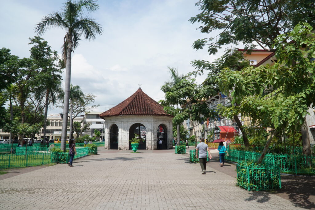 Brick-walled, red roof where Magellan's Cross is kept.