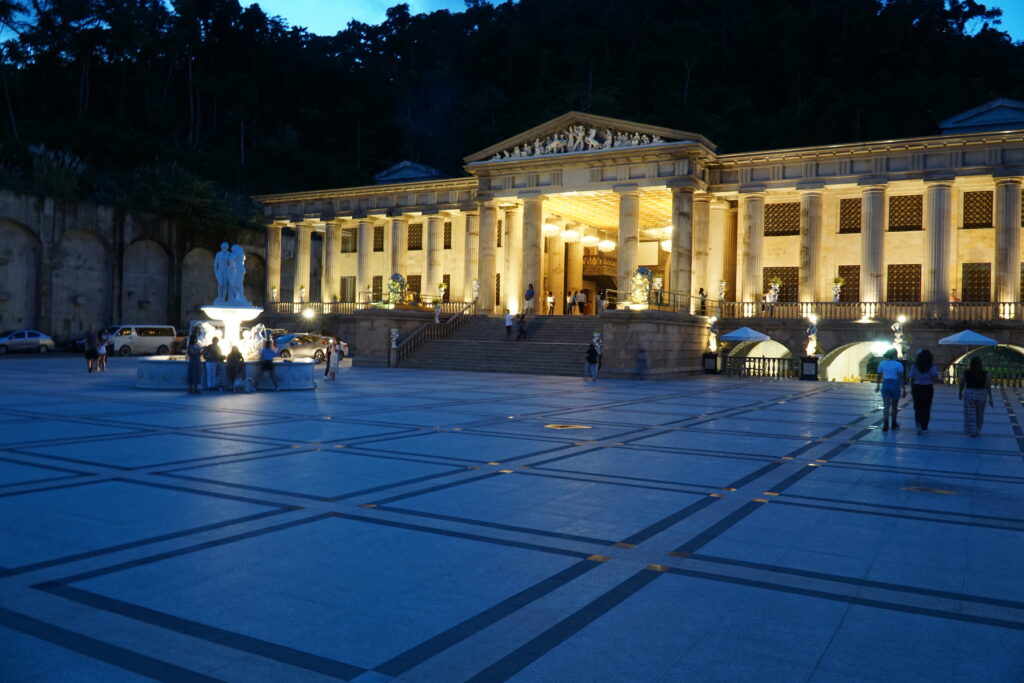Roman-inspired grounds, with fountain on the left.
