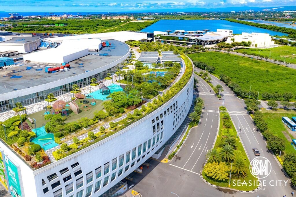 Mall with a garden on top with roads on the right.