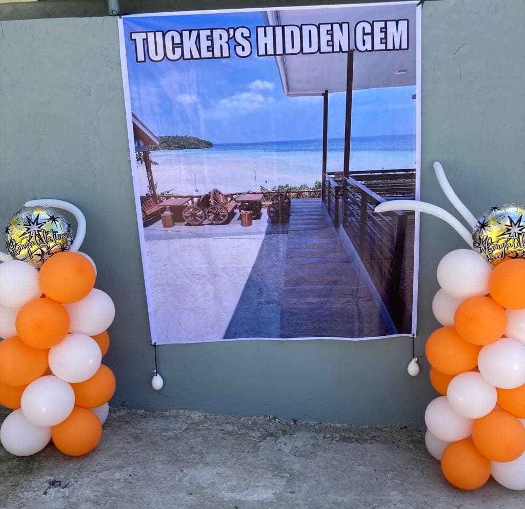 A sign that says "Tucker's Hidden Gem"