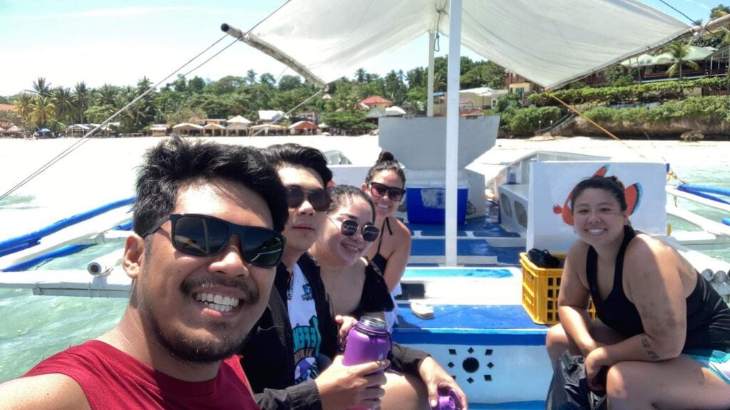 People taking pictures on a boat.