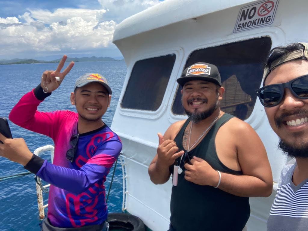 three man on a ferry.